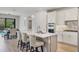 Gourmet kitchen featuring an island with seating and stainless steel appliances at 17910 Waterville Pl, Lakewood Ranch, FL 34202