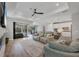 Spacious living room with tile floors, recessed lighting, and access to the outdoor patio at 17910 Waterville Pl, Lakewood Ranch, FL 34202
