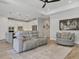 Open living area with sight lines into the kitchen and a seating area at 17910 Waterville Pl, Lakewood Ranch, FL 34202