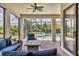 This covered outdoor living space features a ceiling fan and views of the pool at 17910 Waterville Pl, Lakewood Ranch, FL 34202