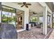 Outdoor patio with brick flooring, ceiling fans, and a comfortable seating area overlooking the pool at 17910 Waterville Pl, Lakewood Ranch, FL 34202
