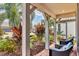 Cozy front patio with comfortable seating and views of the beautiful landscaping at 17910 Waterville Pl, Lakewood Ranch, FL 34202