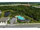 Community pool and cabana area with multiple lounge chairs around a freeform resort-style pool at 2136 Midnight Pearl Dr, Sarasota, FL 34240
