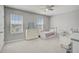 Neutral colored bedroom with two beds, lots of light and neutral decor at 2136 Midnight Pearl Dr, Sarasota, FL 34240