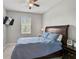 Cozy bedroom featuring a ceiling fan, natural lighting, and comfortable bed with matching nightstands at 2136 Midnight Pearl Dr, Sarasota, FL 34240
