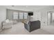 Versatile bonus room with plush carpeting, natural light, and ample space for recreation and relaxation at 2136 Midnight Pearl Dr, Sarasota, FL 34240