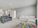 Spacious bonus room with plush carpeting and ample space, with a view through the doorway to another section at 2136 Midnight Pearl Dr, Sarasota, FL 34240