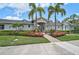 Elegant community clubhouse showcasing manicured lawn and beautiful landscaping at 2136 Midnight Pearl Dr, Sarasota, FL 34240