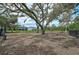 Spacious dog park providing a secure and shaded area for residents' pets to enjoy at 2136 Midnight Pearl Dr, Sarasota, FL 34240