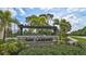 The community entrance sign with lush landscaping welcomes residents and visitors at 2136 Midnight Pearl Dr, Sarasota, FL 34240