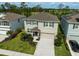 Charming two-story home with well-manicured lawn, a two car garage, and welcoming entrance at 2136 Midnight Pearl Dr, Sarasota, FL 34240