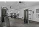 Well-equipped fitness center with modern exercise machines and ample natural light at 2136 Midnight Pearl Dr, Sarasota, FL 34240
