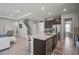 Open-concept kitchen featuring a center island, stainless steel appliances and sleek cabinetry at 2136 Midnight Pearl Dr, Sarasota, FL 34240