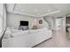 Spacious living room featuring neutral paint, tile floors, recessed lighting, and a staircase to the second floor at 2136 Midnight Pearl Dr, Sarasota, FL 34240