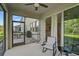 Screened patio providing an outdoor retreat, showcasing backyard views, with connection to the home's interior at 2136 Midnight Pearl Dr, Sarasota, FL 34240