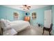 Bright bedroom featuring two windows, ceiling fan, and neutral-toned walls at 2275 Clematis St, Sarasota, FL 34239