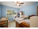 Bedroom filled with stored items and natural light at 2275 Clematis St, Sarasota, FL 34239