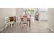 Bright dining area featuring neutral walls, wood table and chairs at 2275 Clematis St, Sarasota, FL 34239