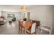 Open layout showcases a dining area with a wooden table and chairs with natural light at 2275 Clematis St, Sarasota, FL 34239