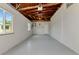 Spacious basement with exposed ceiling beams and ample natural light at 320 59Th W St, Bradenton, FL 34209