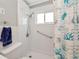 Bathroom featuring a bright shower and nautical-themed shower curtain at 320 59Th W St, Bradenton, FL 34209