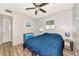 Bedroom featuring a ceiling fan, natural light, and modern interior design at 320 59Th W St, Bradenton, FL 34209