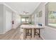 View of a dining area with a breakfast bar, wooden table and four chairs plus built-in storage at 320 59Th W St, Bradenton, FL 34209