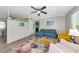 Cozy living room featuring modern furniture, wood-look flooring, and recessed lighting at 320 59Th W St, Bradenton, FL 34209