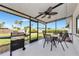 Outdoor patio with a grill, dining table, and scenic backyard view at 320 59Th W St, Bradenton, FL 34209
