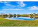 Pond view in a neighborhood of single Gathering homes with well maintained lawns at 3218 Big Sky Way, Bradenton, FL 34211