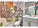 Bathroom features a decorative elephant shower curtain, a white vanity, and a toilet at 3218 Big Sky Way, Bradenton, FL 34211