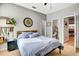 Spacious bedroom features a comfortable bed and easy access to a full bathroom at 3218 Big Sky Way, Bradenton, FL 34211