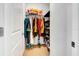 Walk-in closet features ample storage with shelving and racks for organized clothing and accessories at 3218 Big Sky Way, Bradenton, FL 34211