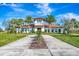 Beautiful new community clubhouse with tile roof, white columns, and tropical landscaping in a desirable neighborhood at 3218 Big Sky Way, Bradenton, FL 34211