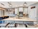 Bright kitchen features granite counters, farmhouse sink, stainless appliances, and decorative lighting at 3218 Big Sky Way, Bradenton, FL 34211