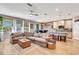 Open floor plan with view of kitchen and water, featuring modern living room at 3218 Big Sky Way, Bradenton, FL 34211