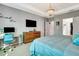 Airy primary bedroom with a view of the bathroom and walk-in closet at 3218 Big Sky Way, Bradenton, FL 34211