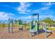 Community playground with climbing equipment, swings, and slide in a lush green park setting at 3218 Big Sky Way, Bradenton, FL 34211