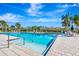 Community pool with tiled deck and lounge chairs, perfect for relaxing on a sunny day at 3218 Big Sky Way, Bradenton, FL 34211