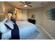 Bedroom features a spacious closet, comfortable bed, and neutral decor with blue and white accents at 3418 79Th Street W Cir # 202, Bradenton, FL 34209