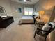 Cozy bedroom features a comfortable bed, soft lighting, and neutral decor with a ceiling fan at 3418 79Th Street W Cir # 202, Bradenton, FL 34209