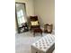 Comfortable sitting area with leather chair, ottoman, side table and large mirror in bedroom at 3418 79Th Street W Cir # 202, Bradenton, FL 34209