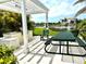 Community area with grill and picnic table overlooking a lake at 3418 79Th Street W Cir # 202, Bradenton, FL 34209