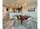 Cozy dining area featuring wood table, wicker chairs and decorative chandelier at 3418 79Th Street W Cir # 202, Bradenton, FL 34209