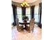 Enjoy your meals in this dining room with natural lighting and wicker furniture at 3418 79Th Street W Cir # 202, Bradenton, FL 34209