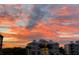 Exterior view of building with a vibrant colorful sunset and palm trees at 3418 79Th Street W Cir # 202, Bradenton, FL 34209