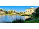 Water view of buildings featuring balconies and set in a scenic community at 3418 79Th Street W Cir # 202, Bradenton, FL 34209