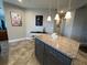 An accent island with granite countertop and neutral colored cabinets at 3418 79Th Street W Cir # 202, Bradenton, FL 34209