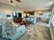 Cozy living room with large TV, comfortable seating, and view of the dining area at 3418 79Th Street W Cir # 202, Bradenton, FL 34209