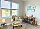 Relaxing sitting area with window view and decorative accents at 3418 79Th Street W Cir # 202, Bradenton, FL 34209